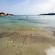 People enjoying a shallow water beach